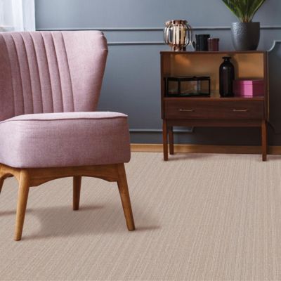 textured carpet in a living room with accent chair